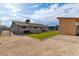 Large backyard features turf, a storage shed, a patio, and gravel providing ample space for outdoor activities at 3682 Deer Creek Way, Las Vegas, NV 89115