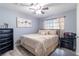 Serene bedroom with modern decor, neutral tones, and natural light creates a relaxing and inviting retreat at 3682 Deer Creek Way, Las Vegas, NV 89115
