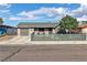 Charming single-story home with a well-manicured lawn, garage, and a modern horizontal fence at 3682 Deer Creek Way, Las Vegas, NV 89115
