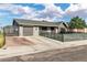 Inviting single-story home with a well-manicured lawn, garage, and brick-lined driveway at 3682 Deer Creek Way, Las Vegas, NV 89115