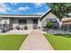 Charming single-story home with artificial grass, a horizontal fence, and a brick pathway at 3682 Deer Creek Way, Las Vegas, NV 89115
