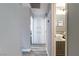 Hallway with built-in storage cabinets leading to bathroom with vessel sink at 3682 Deer Creek Way, Las Vegas, NV 89115