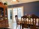 Inviting dining room with tile floors and sliding doors to the patio at 3766 Colonial Dr, Las Vegas, NV 89121