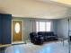 Cozy living room with neutral walls, tile floors, and a bright window at 3766 Colonial Dr, Las Vegas, NV 89121