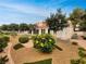 Lush backyard landscaping features a beautiful lawn, bushes, and trees at 3957 Placita Del Lazo, Las Vegas, NV 89120