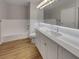 Bright bathroom with double vanity, modern lighting, and soaking tub at 3957 Placita Del Lazo, Las Vegas, NV 89120