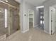 Bathroom featuring a glass shower, and entryway to an adjacent room at 3957 Placita Del Lazo, Las Vegas, NV 89120