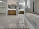 Bathroom with separate vanity areas, a large tub, and tiled flooring at 3957 Placita Del Lazo, Las Vegas, NV 89120