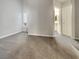 Neutral bedroom featuring plush gray carpet, natural light, and ensuite access at 3957 Placita Del Lazo, Las Vegas, NV 89120