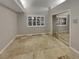 Bedroom with tile flooring, large windows, and mirrored closet doors at 3957 Placita Del Lazo, Las Vegas, NV 89120