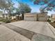 Home featuring a large driveway and multi-car garage at 3957 Placita Del Lazo, Las Vegas, NV 89120