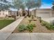 Charming single-story home featuring a well-manicured front yard and a two-car garage at 3957 Placita Del Lazo, Las Vegas, NV 89120