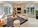 Bright living room with fireplace, built-ins, and double doors to bring the outdoors in at 3957 Placita Del Lazo, Las Vegas, NV 89120