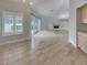 Open-concept living area with a fireplace and tile flooring at 3957 Placita Del Lazo, Las Vegas, NV 89120