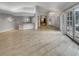 Large living area with bar, tile flooring, and multiple windows at 3957 Placita Del Lazo, Las Vegas, NV 89120