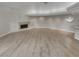 Spacious living room featuring a fireplace and neutral tile flooring at 3957 Placita Del Lazo, Las Vegas, NV 89120