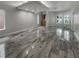 Spacious living room with marble floors, recessed lighting, and wet bar at 3957 Placita Del Lazo, Las Vegas, NV 89120