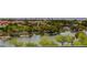 Panoramic lake view of the real estate neighborhood featuring lush trees and serene waters at 3980 Heron Fairway Dr, Las Vegas, NV 89141