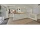 Entertainment area with a built-in bar, mirrors, tiled floors, and access to an outdoor space at 4139 Abernethy Forest Pl, Las Vegas, NV 89141