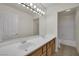 Bathroom features a double sink vanity, a large mirror and a bathtub with shower at 4139 Abernethy Forest Pl, Las Vegas, NV 89141