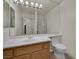 Well-lit bathroom featuring a single sink vanity, toilet, and a shower-tub combination at 4139 Abernethy Forest Pl, Las Vegas, NV 89141