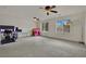 Bonus room with two ceiling fans, carpet, two windows and a work station at 4139 Abernethy Forest Pl, Las Vegas, NV 89141
