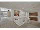 An upstairs hallway with arch and views into living room and built-in cabinets at 4139 Abernethy Forest Pl, Las Vegas, NV 89141