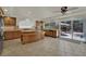 Spacious kitchen with an island, tile countertops, cabinets, and stainless steel appliances at 4139 Abernethy Forest Pl, Las Vegas, NV 89141