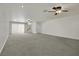 Spacious living area features new carpet, recessed lighting, and backyard access at 4139 Abernethy Forest Pl, Las Vegas, NV 89141