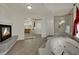 Main bathroom features a cozy fireplace and a walk-in shower, adjoining the soaking tub at 4139 Abernethy Forest Pl, Las Vegas, NV 89141