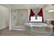 Luxurious primary bathroom featuring a walk-in shower and a large soaking tub at 4139 Abernethy Forest Pl, Las Vegas, NV 89141