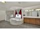 An expansive main bathroom includes a walk-in shower, soaking tub and dual vanities at 4139 Abernethy Forest Pl, Las Vegas, NV 89141