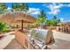 Built-in grill station in the outdoor kitchen area, perfect for backyard entertaining at 4139 Abernethy Forest Pl, Las Vegas, NV 89141