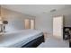 Bright bedroom with neutral tones, ensuite bathroom, and walk in closet provides a relaxing space at 4293 Nopal Serrano Ave, Las Vegas, NV 89141