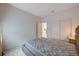 Well-lit bedroom with neutral tones and a sliding door closet provides a relaxing space at 4293 Nopal Serrano Ave, Las Vegas, NV 89141