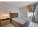 Comfortable bedroom with neutral tones and natural light is perfect for relaxation and rest at 4293 Nopal Serrano Ave, Las Vegas, NV 89141