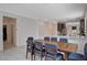 Spacious dining area with direct access to the kitchen, complete with tile flooring and neutral walls at 4293 Nopal Serrano Ave, Las Vegas, NV 89141