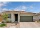 Charming single-story home with a two-car garage and a beautifully landscaped front yard at 4293 Nopal Serrano Ave, Las Vegas, NV 89141