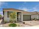 Well-maintained home featuring a stone driveway, manicured landscaping, and a cozy front entrance at 4293 Nopal Serrano Ave, Las Vegas, NV 89141