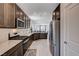 Spacious kitchen featuring a gas range stove and stainless steel refrigerator at 4293 Nopal Serrano Ave, Las Vegas, NV 89141