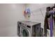 This functional laundry room is equipped with modern washer and dryer and offers plenty of space at 4293 Nopal Serrano Ave, Las Vegas, NV 89141