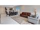 Bright living room with an elegant area rug, comfortable seating, and open access to the kitchen at 4293 Nopal Serrano Ave, Las Vegas, NV 89141