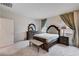 Inviting main bedroom with carpet, dresser, and en-suite bath at 4293 Nopal Serrano Ave, Las Vegas, NV 89141