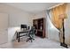 Well-lit office space featuring a modern desk setup and a comfortable office chair perfect for productivity at 4293 Nopal Serrano Ave, Las Vegas, NV 89141