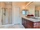 Updated bathroom features a double sink vanity and glass-enclosed shower at 4311 Fiore Bella Blvd, Las Vegas, NV 89135