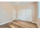 Bedroom with wood-look floors and built in closets at 4311 Fiore Bella Blvd, Las Vegas, NV 89135