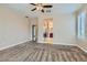 Carpeted bedroom features a ceiling fan and neutral walls at 4311 Fiore Bella Blvd, Las Vegas, NV 89135
