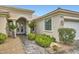 Close up of entrance with double doors, beautiful landscaping and paver walkway at 4311 Fiore Bella Blvd, Las Vegas, NV 89135