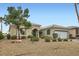 Desert landscaped front yard with a charming stucco home and tiled roof at 4311 Fiore Bella Blvd, Las Vegas, NV 89135