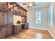 Bright living room features custom built-in shelving, cabinets, and modern window shutters at 4311 Fiore Bella Blvd, Las Vegas, NV 89135